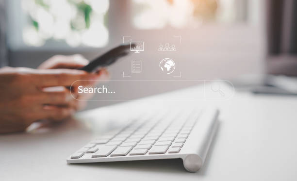 person texting in front of keyboard