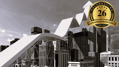 Construction site with a white curved pedestrian ramp over scaffolding and city buildings; top-right badge reads 'Celebrating 26 years of sustained excellence'.